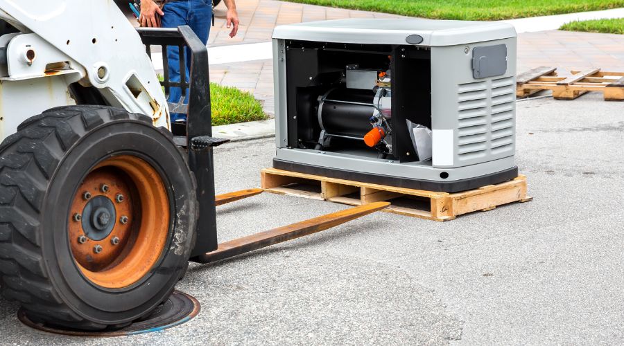 Standby generator installation being delivered on a pallet, showcasing the generator's exterior and components, emphasizing its role in providing backup power during outages.